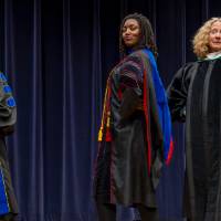 Faculty posing with Provost Drake